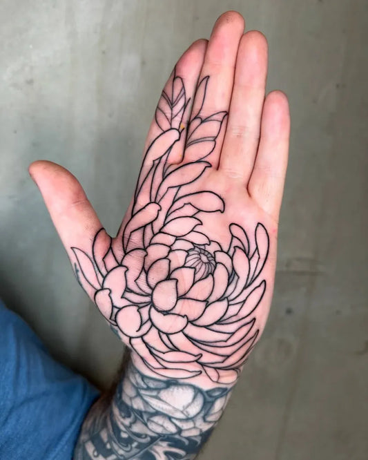 Small Outline Chrysanthemum Leaves Tattoo on Men Hand by @lukeaashley