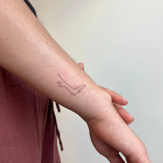 Small Outline Dachshund Tattoo on Women Wrist by @circle_tattoo_serena