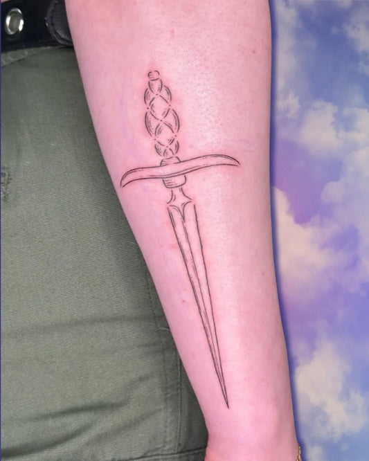 Small Outline Dagger Tattoo on Women Arm by @shanban.tats