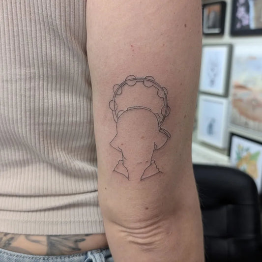 Small Outline Elephant with Halo Tattoo on Women Upper Arm by @megansmithevans