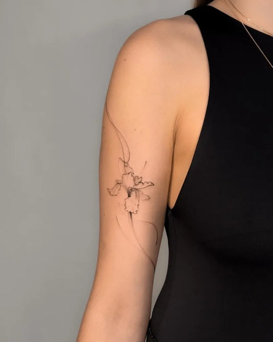 Small Outline Flower Tattoo on Women Shoulder by @narcyz_tattoo