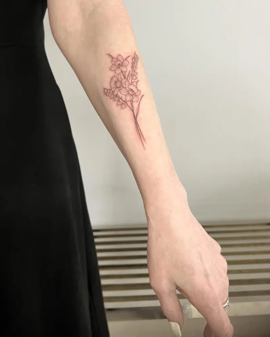 Small Outline Flowers Tattoo on Women Arm by @circatattoo