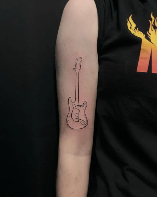 Small Outline Guitar Tattoo on Women Arm by @rosiemalonetattoos