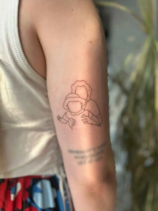 Small Outline Hugging Figures Tattoo on Women Arm by @ju.liness