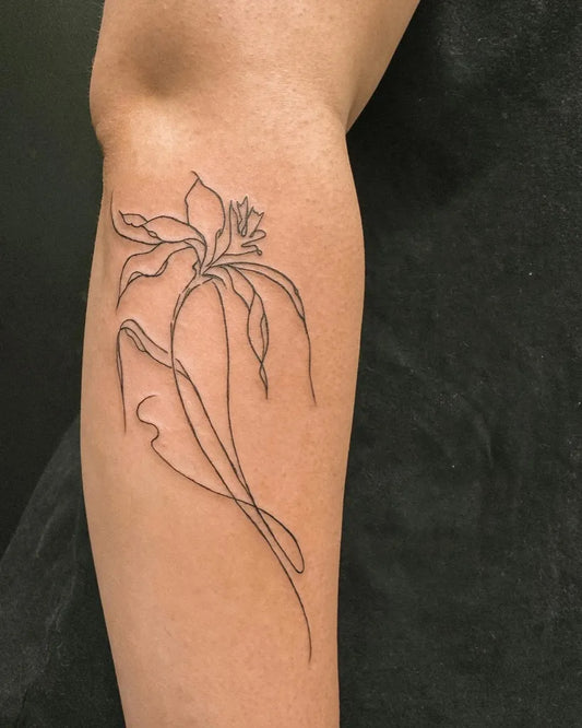 Small Outline Lily Tattoo on Women Arm by @hybridink.helsinki