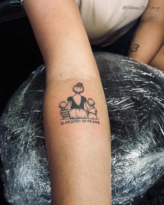 Small Outline Mother with two children and dates Tattoo on Women Arm by @vinay_dut