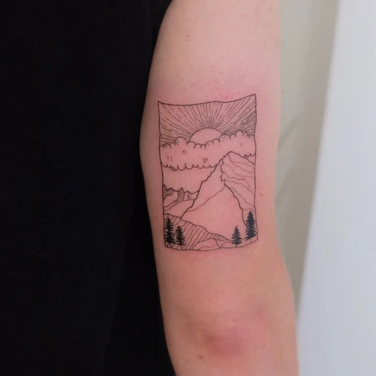 Small Outline Mountain Sun Trees Tattoo on Women UpperArm by @claudiagebauertattoo