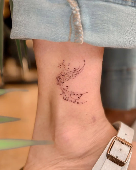 Small Outline Phoenix Tattoo on Women Ankle by @littledarlingstudios