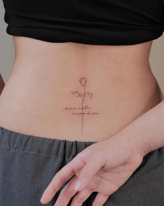 Small Outline Rose with Latin Text Tattoo on Women Back by @miko_nyctattoo