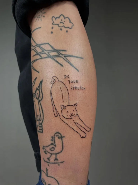 Small Outline Stretching Cat and Bird Tattoo on Women Leg by @bayernperle