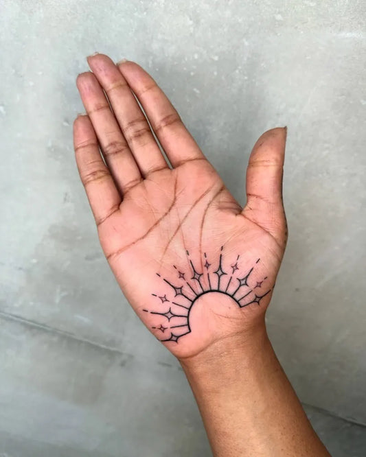 Small Outline Sun Tattoo on Women Hand by @lukeaashley