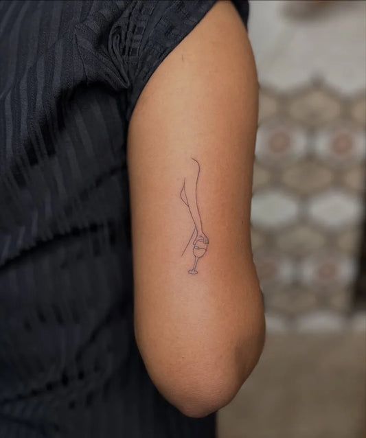 Small Outline Wine Glass Tattoo on Women Arm by @vijaytattooartist