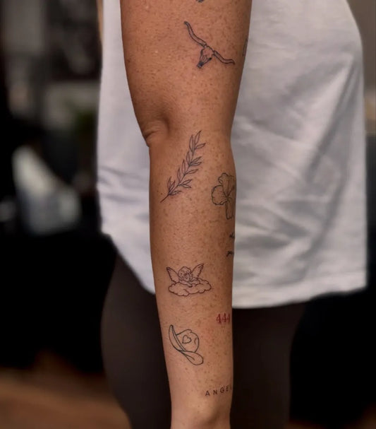 Small Patchwork Bird Laurel Flower on Women Arm Tattoo by @ink_by_jessrose