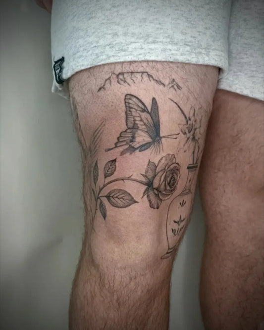 Small Patchwork Butterfly Rose Mountains on Men Thigh Tattoo by @martatattoos