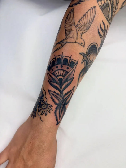 Small Patchwork Dove and Flower on Men Arm Tattoo by @lottitattoos