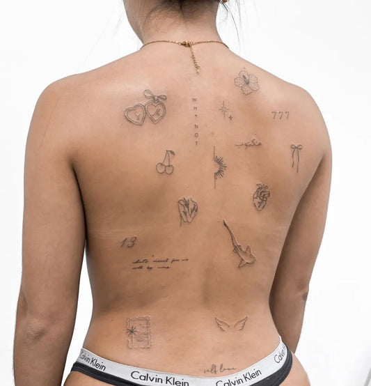 Small Patchwork FruitsAngelsGuitar on Women Back Tattoo by @shinktattoo