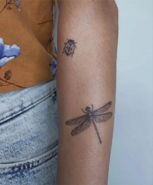 Small Patchwork Ladybug and Dragonfly on Women Arm Tattoo by @rabb.tattoo