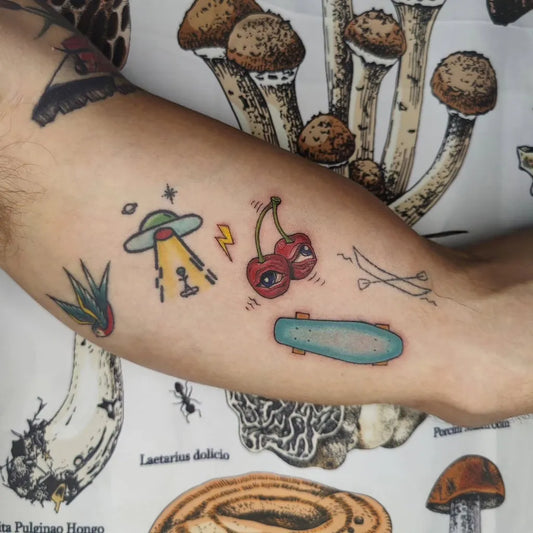 Small Patchwork Mushrooms UFO Skateboard on Men Arm Tattoo by @nutmyart