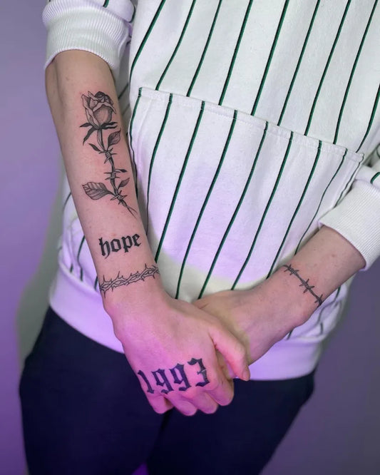 Small Patchwork Rose Hope Text 1993 Text Barbed Wire on Women Arm Tattoo by @black_jungletattoo