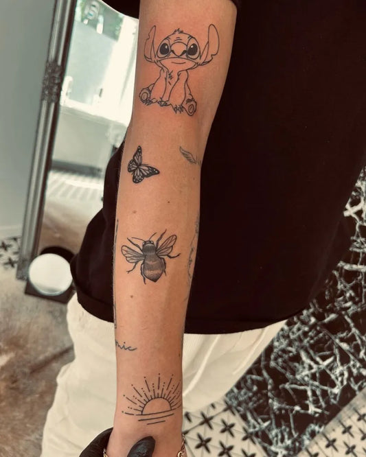 Small Patchwork Stitch Butterfly Bee on Women Arm Tattoo by @bart.studio