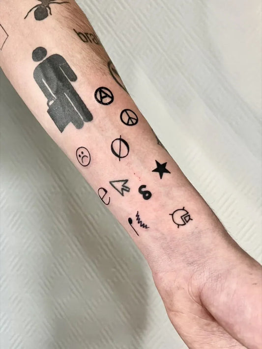 Small Patchwork Symbols on Men Arm Tattoo by @flushlenitattoo