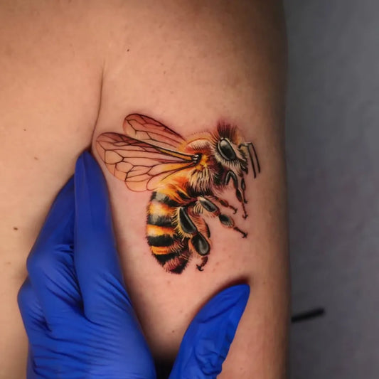 Small Realism Bee on Women Shoulder Tattoo by @zulezutattoo