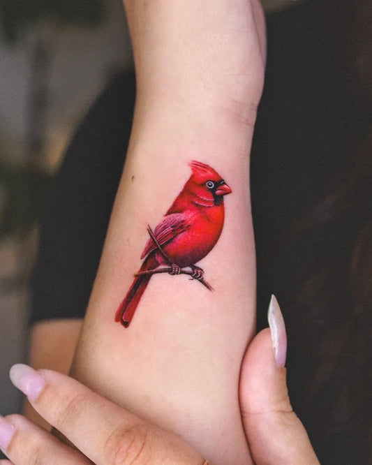 Small Realism Cardinal Bird Tattoo on Women Wrist by @ssunc