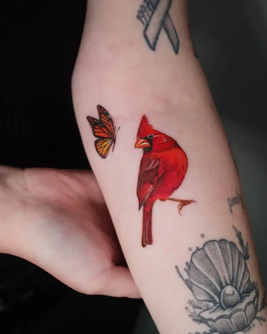 Small Realism Cardinal and Monarch Butterfly Tattoo on Women Arm by @its.freegee