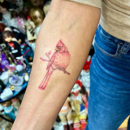 Small Realism Cardinal on Branch Tattoo on Women Arm by @themackisinsession