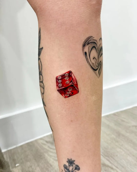 Small Realism Dice Tattoo on Women Leg by @wiktoria.tatts