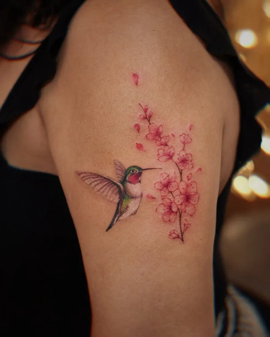 Small Realism Hummingbird and Cherry Blossom on Women Arm Tattoo by @vivi_tattooer