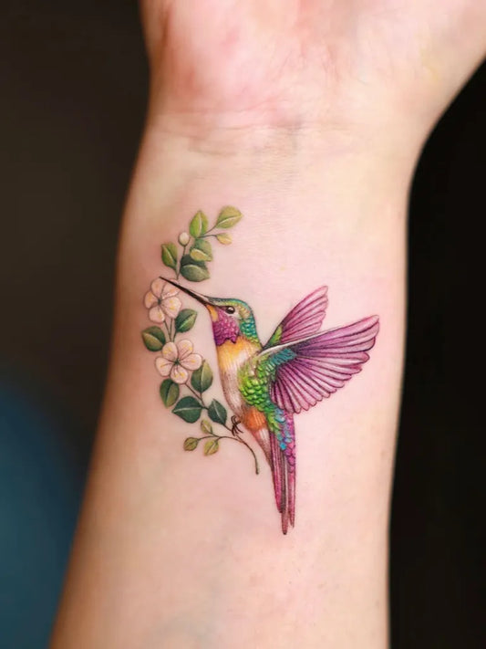 Small Realism Hummingbird and Flowers Tattoo on Women Wrist by @xiso_ink
