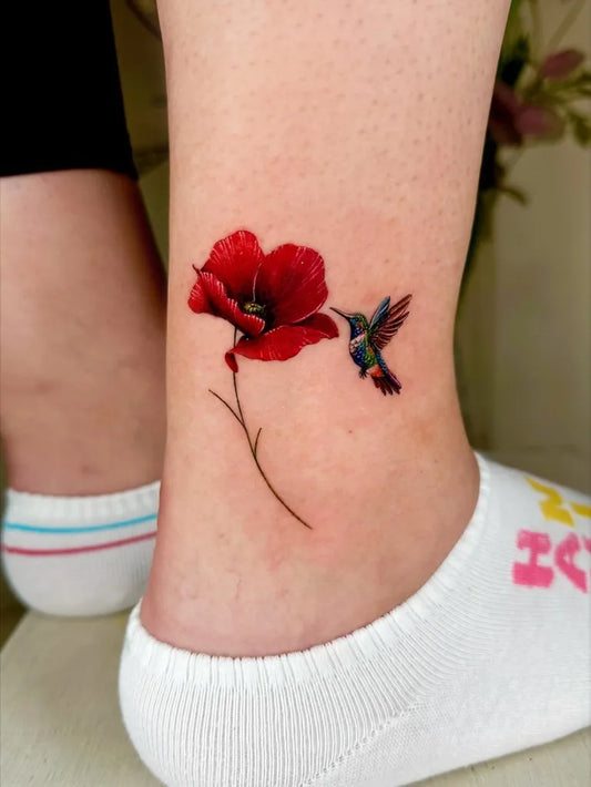 Small Realism Hummingbird and Poppy Flower on Women Ankle Tattoo by @claire_tattoos_