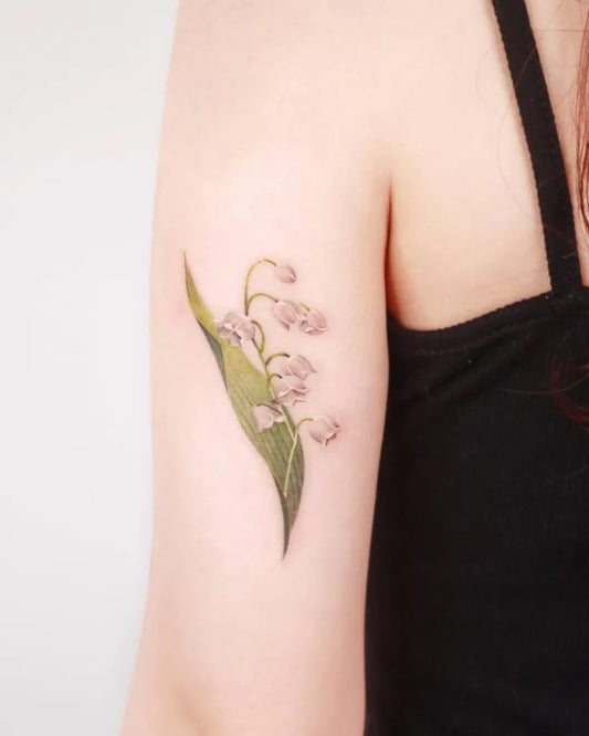 Small Realism Lily of the Valley Women Arm Tattoo by @sozil_tattoo