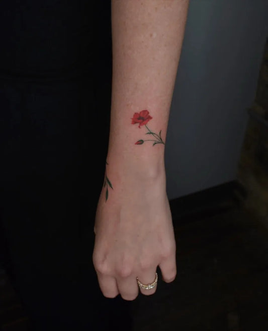 Small Realism Poppy Flower Tattoo on Women Arm by @k_inx