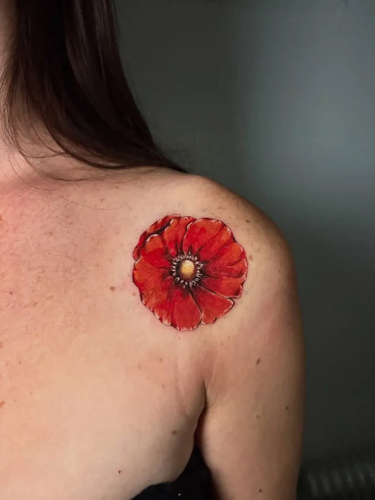 Small Realism Poppy Tattoo on Women Shoulder by @ttt_cami