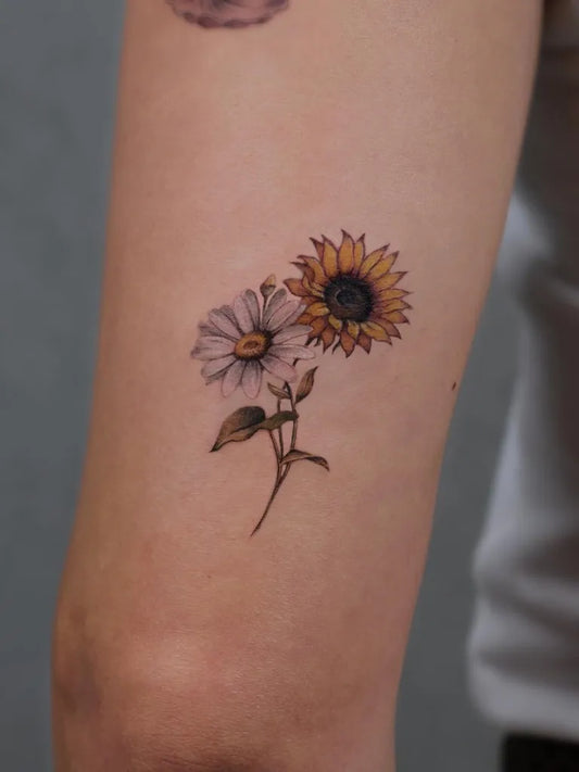 Small Realism Sunflower Daisy on Women Arm Tattoo by @ceren.tattoo