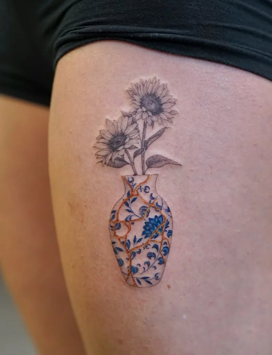 Small Realism Sunflower Vase on Women Thigh Tattoo by @tattooartbyhailey