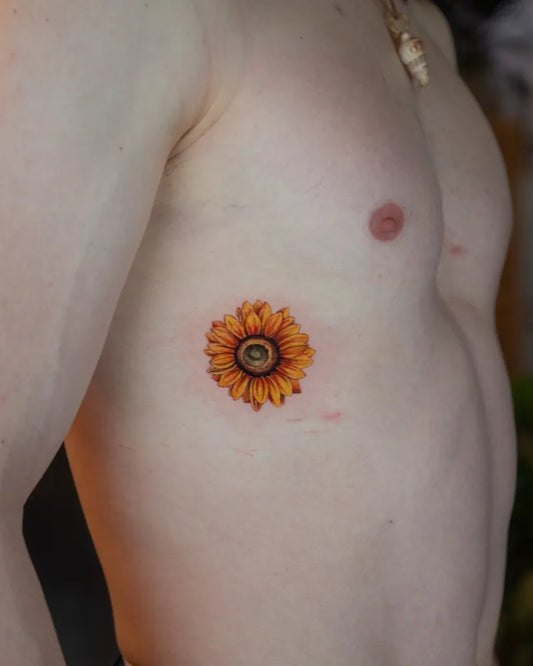 Small Realism Sunflower on Men Chest Tattoo by @byandylopez