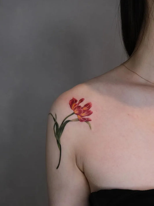 Small Realism Tulip Tattoo on Women Shoulder by @___soil