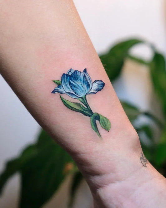 Small Realism Tulip Tattoo on Women Wrist by @aysan.ink