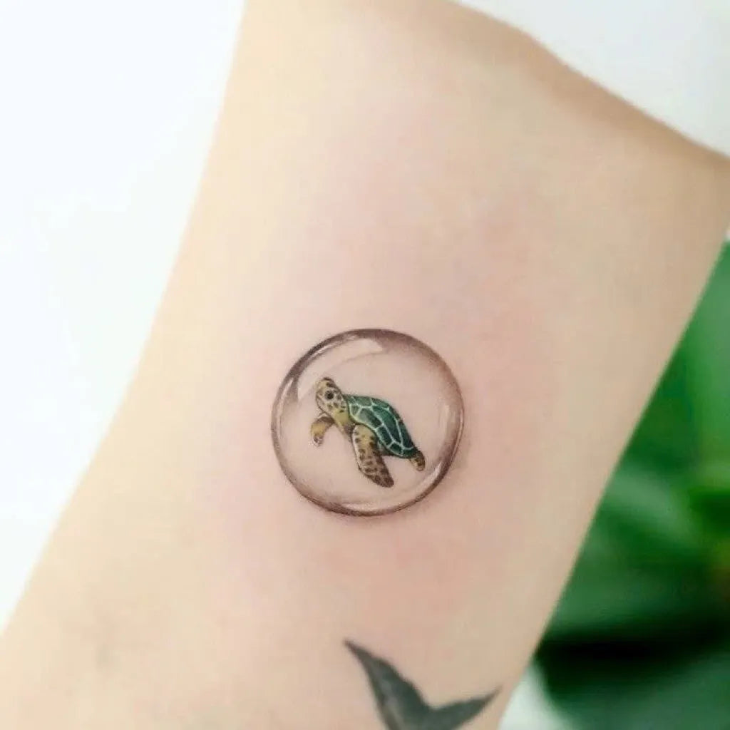 Small Realism Turtle in Bubble Tattoo on Women Forearm by @tattoo_korea_