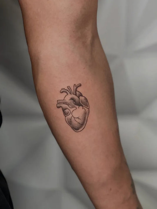 Small Realistic Heart on Men Arm Tattoo by @prjct.44