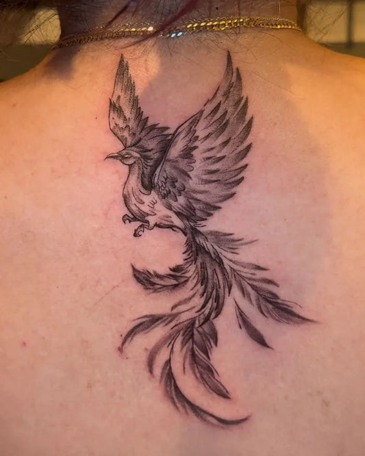Small Realistic Phoenix on Women Upper Back Tattoo by @jeorgewithaj
