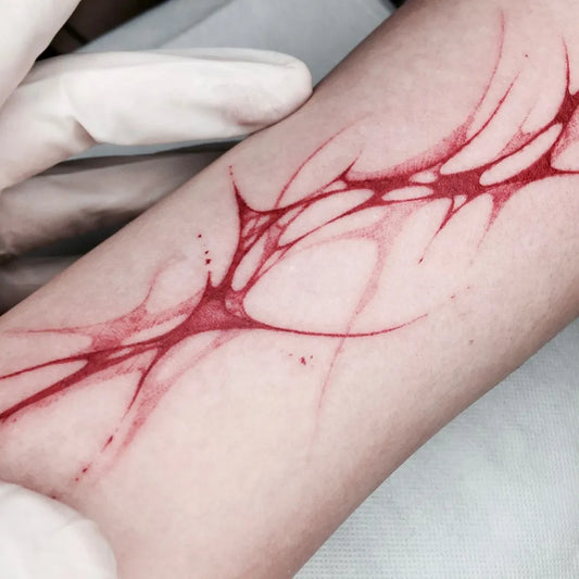Small Red Blood Veins Tattoo on Women Arm by @chou.z1_