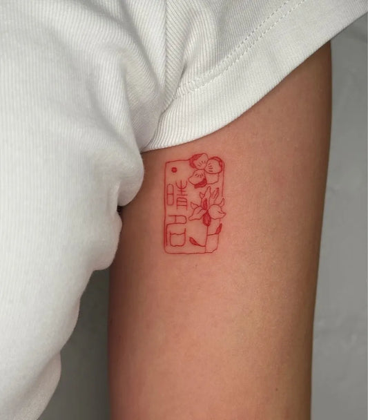 Small Red ChineseSeal Tattoo on Women Arm by @inkdbylyss