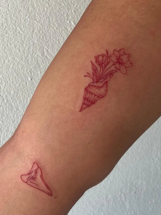 Small Red Flower Bunch Conch Shell Shark Fin Tattoo on Women Arm by @tattoos.leray