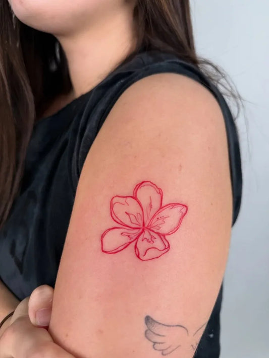 Small Red Hibiscus Flower Tattoo on Women Arm by @mei.tatts