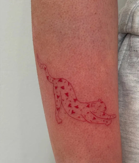 Small Red Leopard Tattoo on Women Arm by @myca__ink