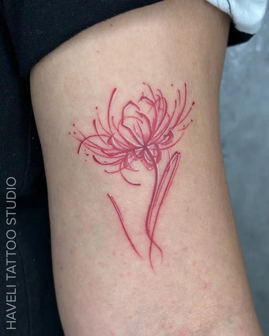 Small Red Spider Lily Tattoo on Women Arm by @havelitattoo